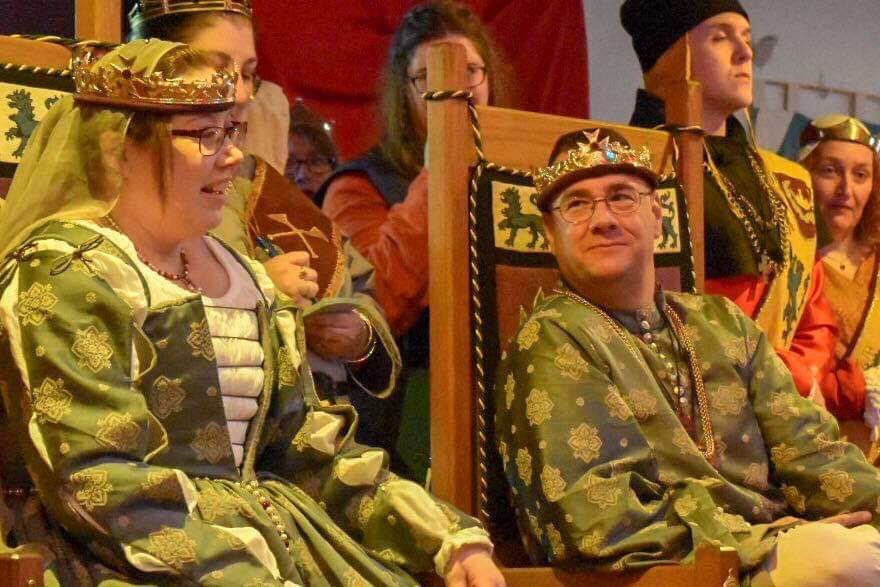 King Wilhelm looks on while Queen Vienna speaks as they sit upon the Thrones of the East during their last court.