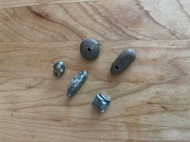 2Weights: Top L-R: 2 clay, Bottom L-R modern steel, rock, folded reproduction